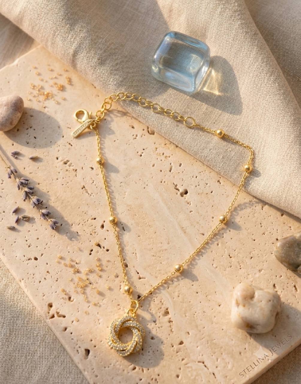 Bracciale Catenina con Ciondolo Nodo Pavé – Confezione da 12 Pezzi